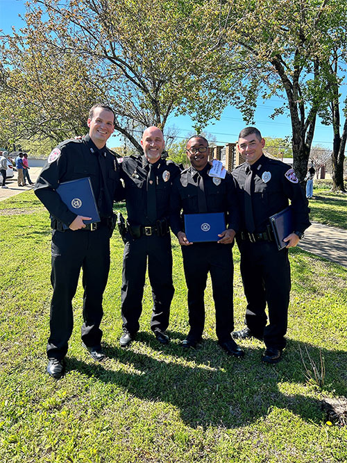 ɫƵ Assistant Police Chief Brian Locke, second from left, recently congratulated MSUPD officers Tyler Hawkins, left, Deveair Salter, and William Bowling on their graduation from the North Mississippi Law Enforcement Training Academy